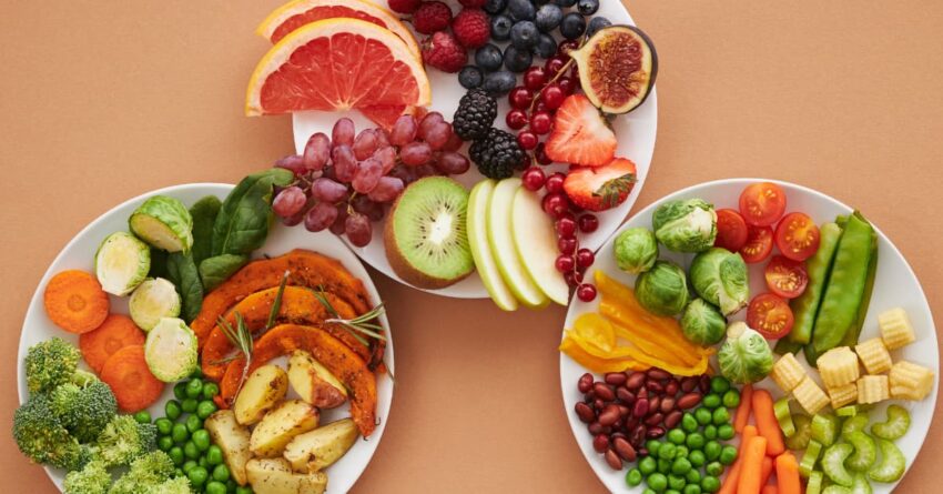 A table setting, filled with different plates with healthy food for a low carb high protein diet.