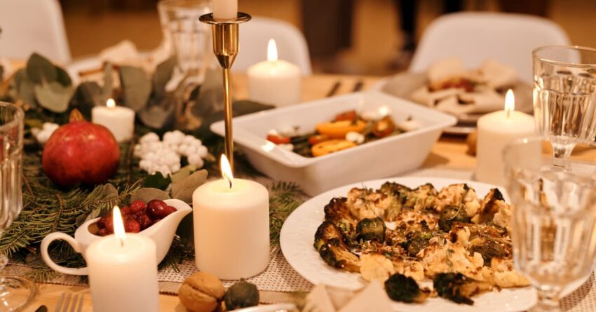 An Easter dinner set up, with candles and fancy dinnerware.
