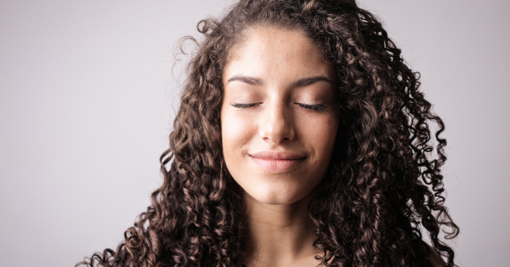 Images of a girl with beautiful, curly hair, highlighting hair treatment for hair loss.