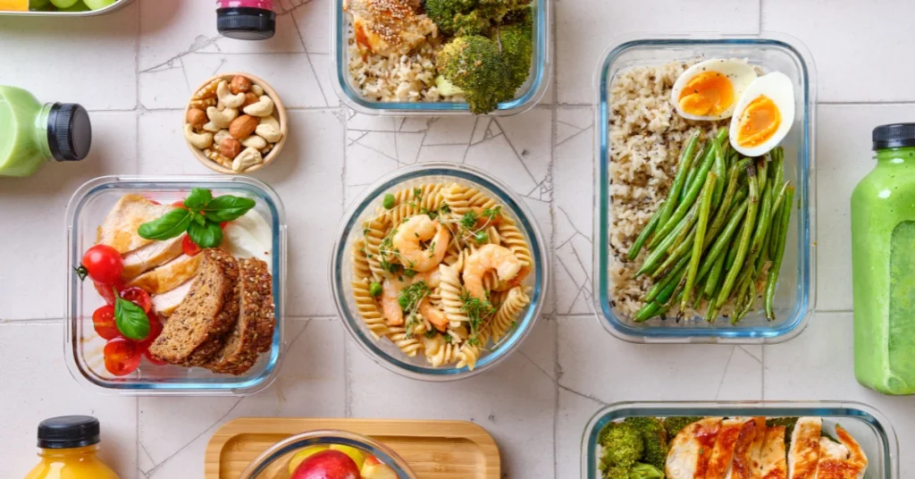 A table setting of different lunch boxes, that someone can eat for Intermittent fasting meal plan. 
